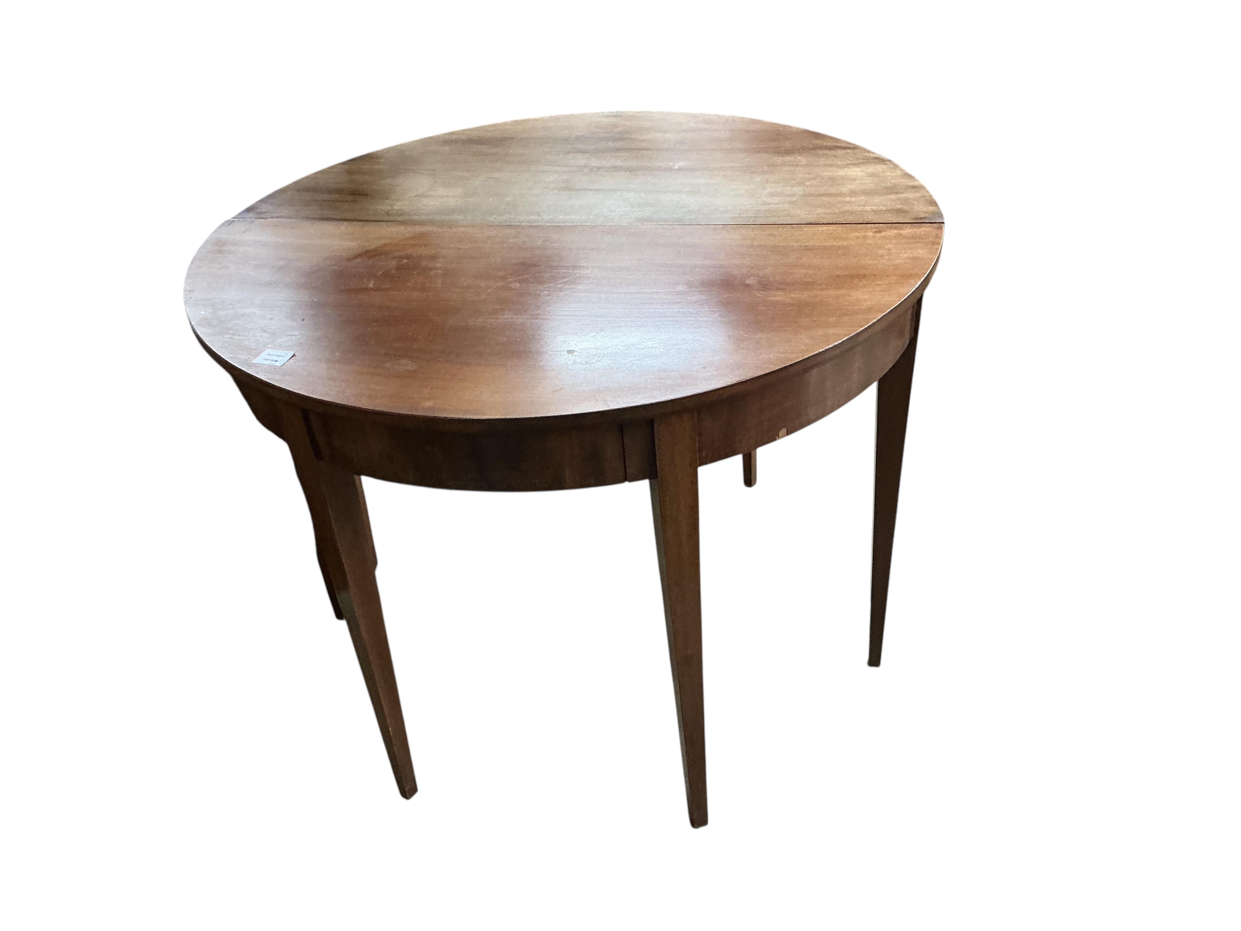 A pair of George III mahogany 'D' shaped tables, each fitted with a single drawer, each width 104cm, depth 50cm, height 76cm together with a pair of George III mahogany dining chairs
